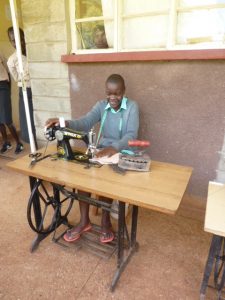 Damaris using new sewing machine